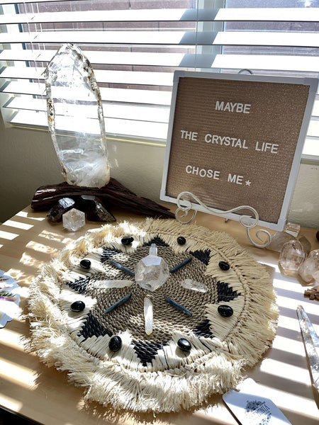 crystal grid on black raffia mat